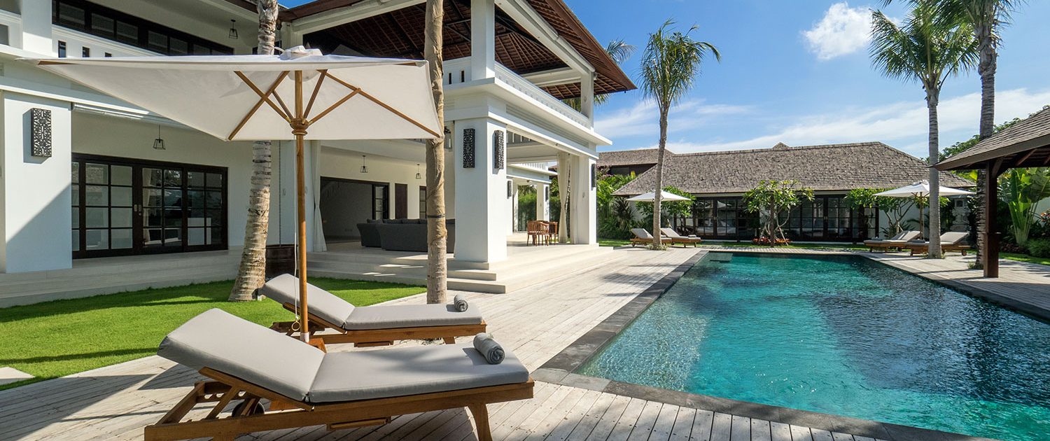 Loungers, parasol and pool Villa Tjitrap Seminyak Bali